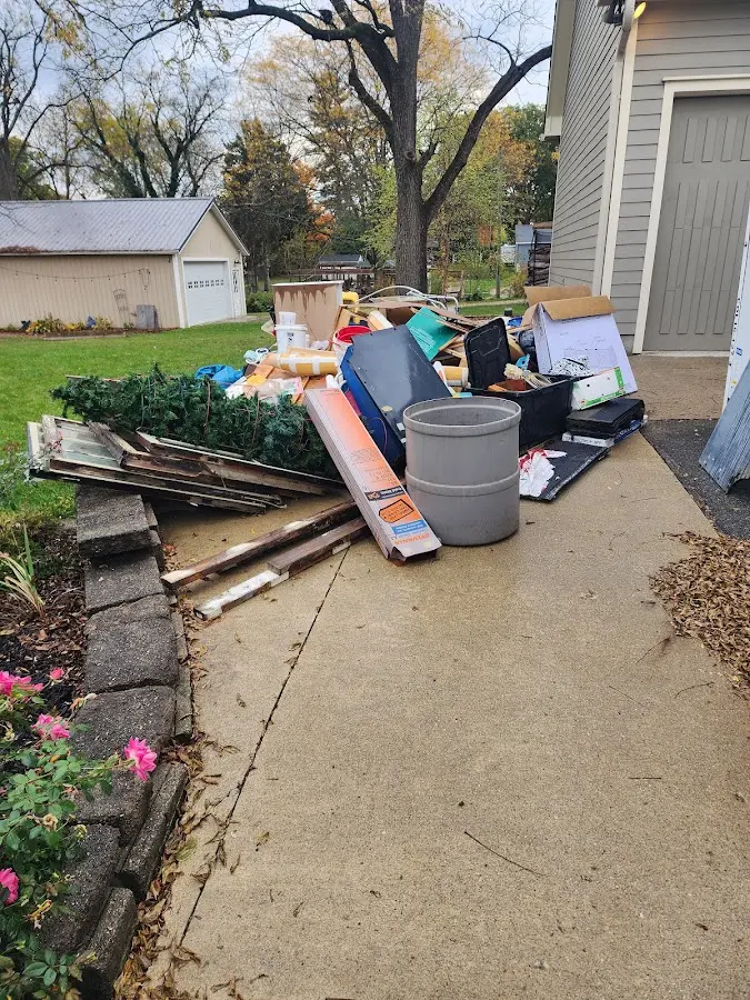 Dumpster being loaded with debris for Residential Dumpster Rental in Avon Lake